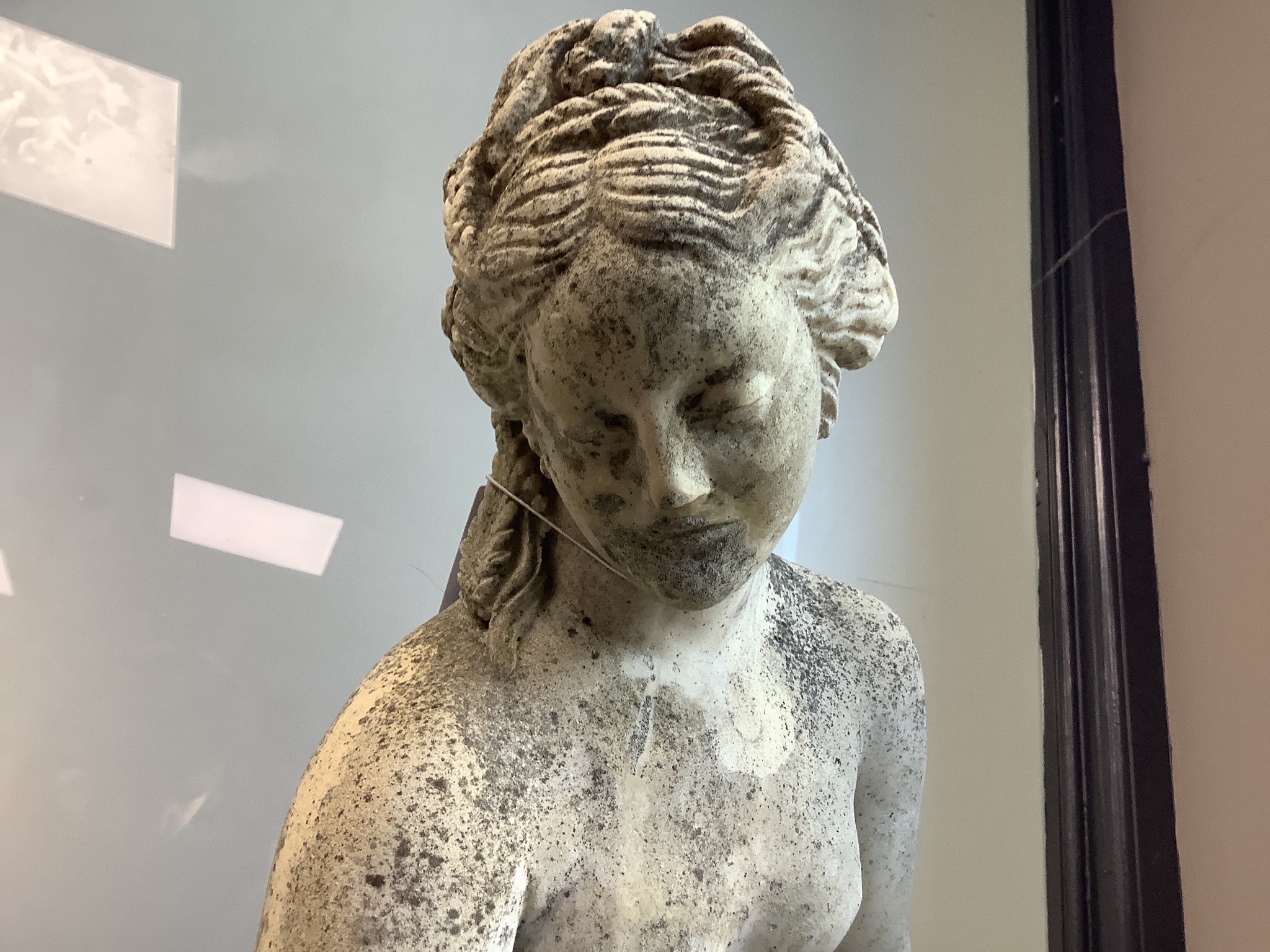 A 19th century carved marble statue of Venus, raised on a reconstituted plinth, height 135cm